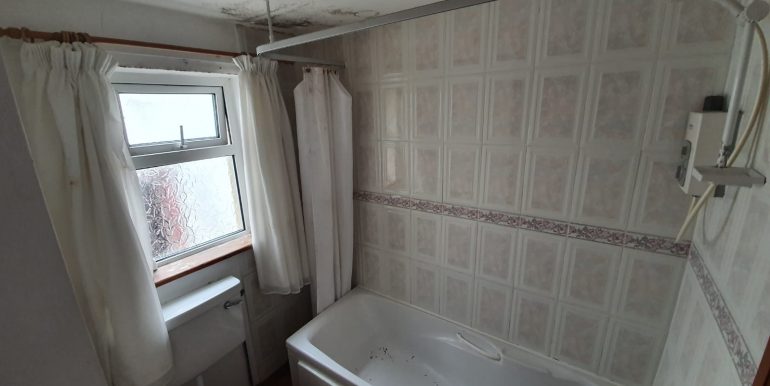 Angela Boyle - Bathroom with bath and shower.
